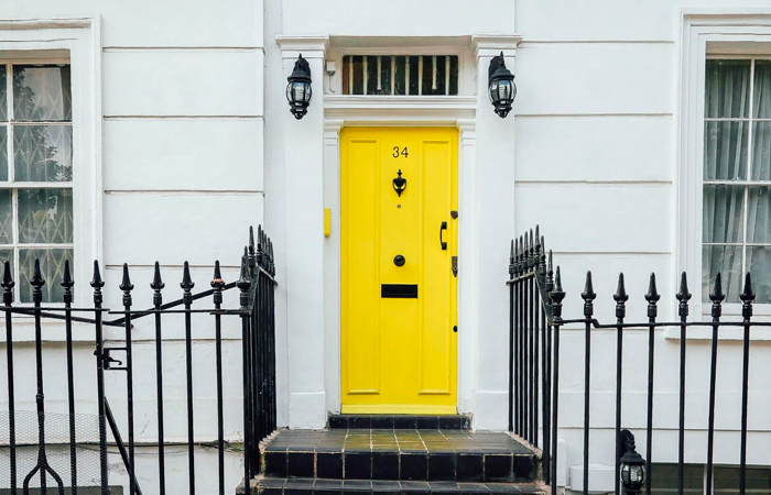 Image of yellow front door to represent students leaving home.